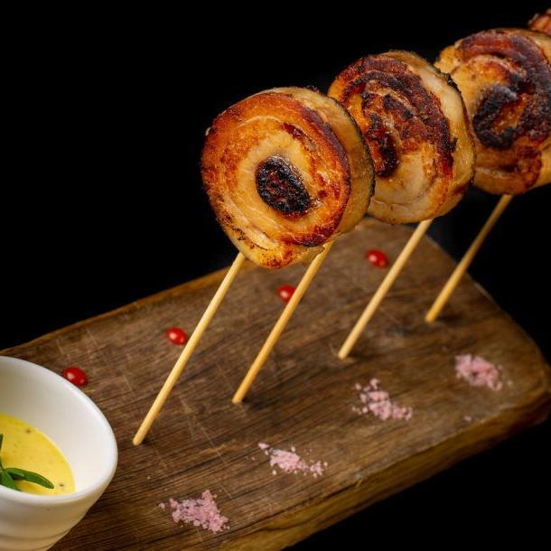 Lollipop of pork in mustard and honey sauce